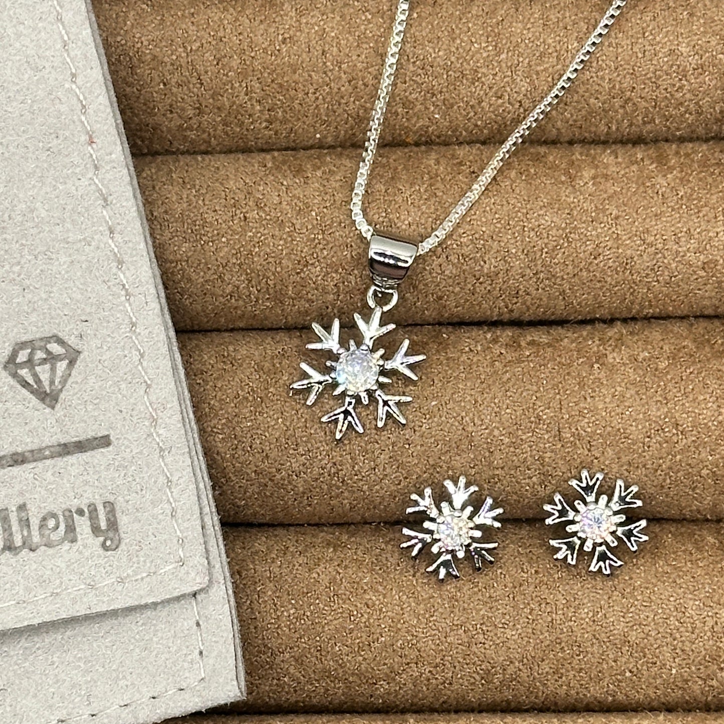 silver snowflake pendant and stud earrings