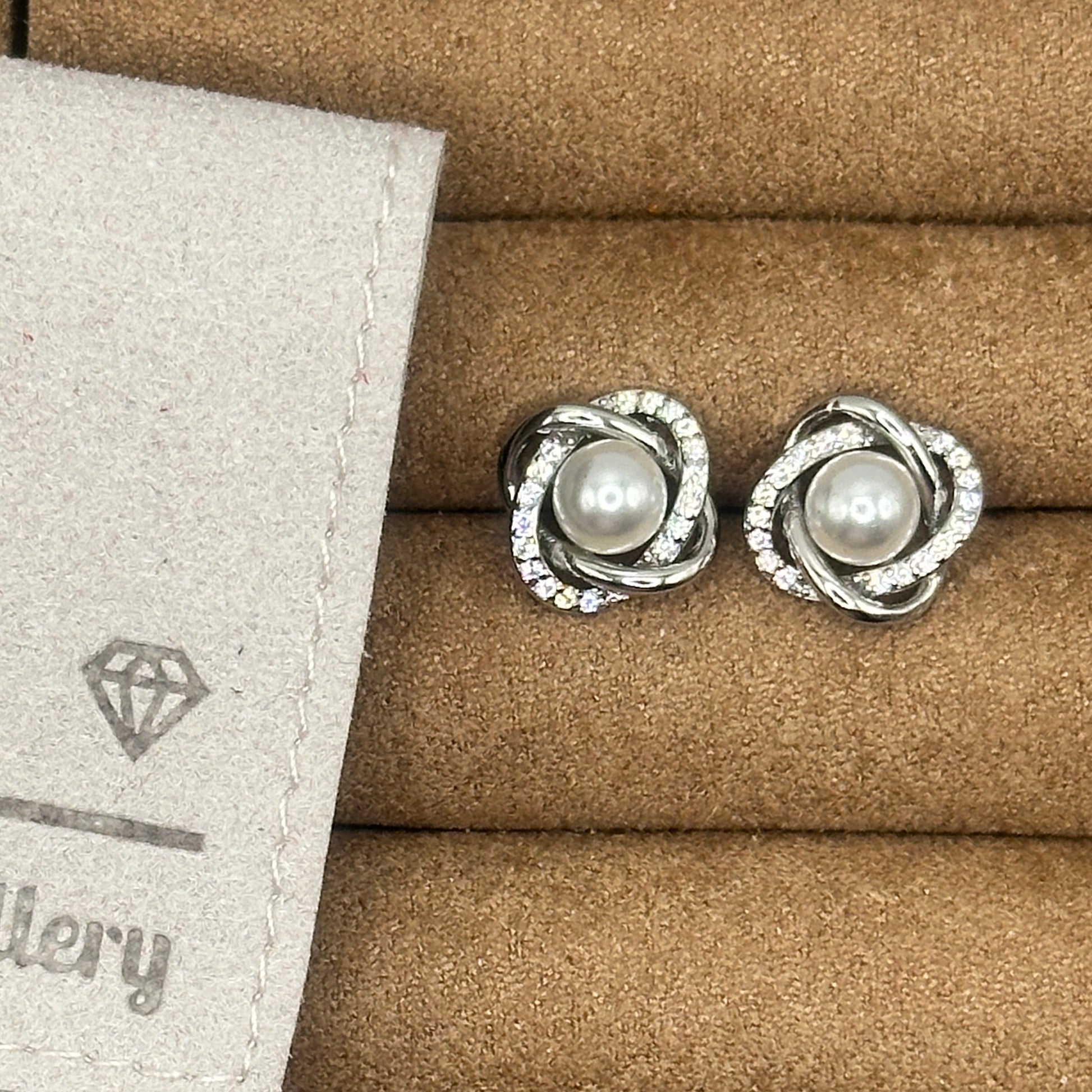 Orbit twist silver pearl stud earrings 