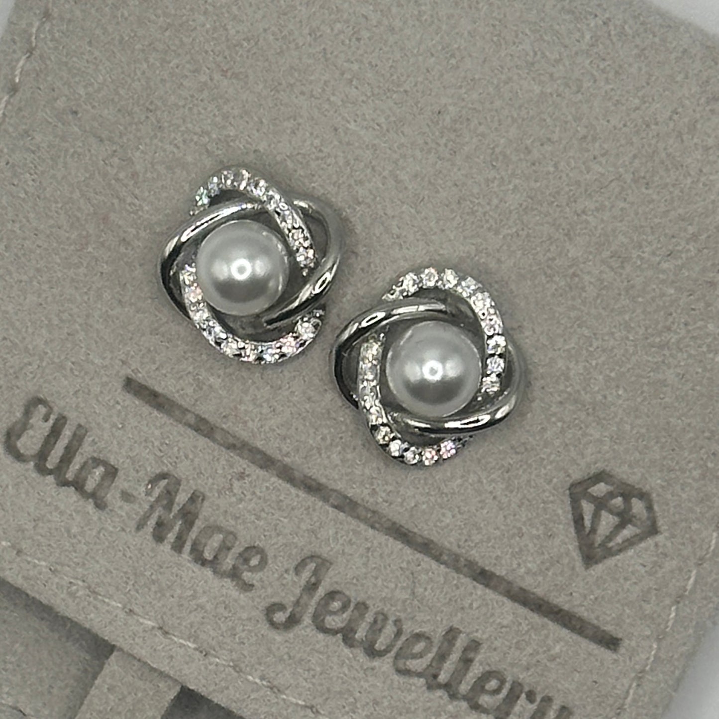 Orbit twist silver pearl earrings