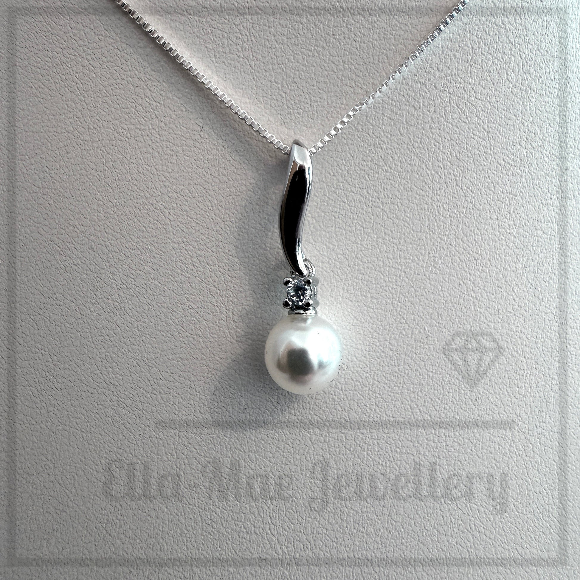 Grace Pearl Pendant necklace on silver box chain with EMJ logo