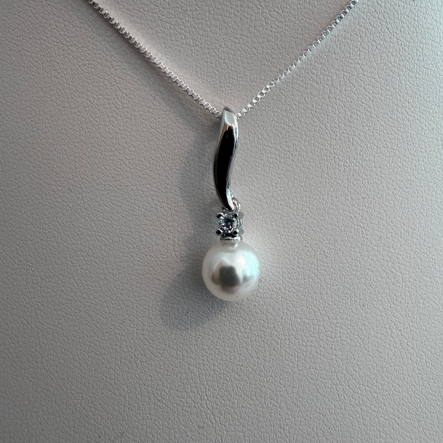 Grace Pearl Pendant necklace on silver box chain on white background