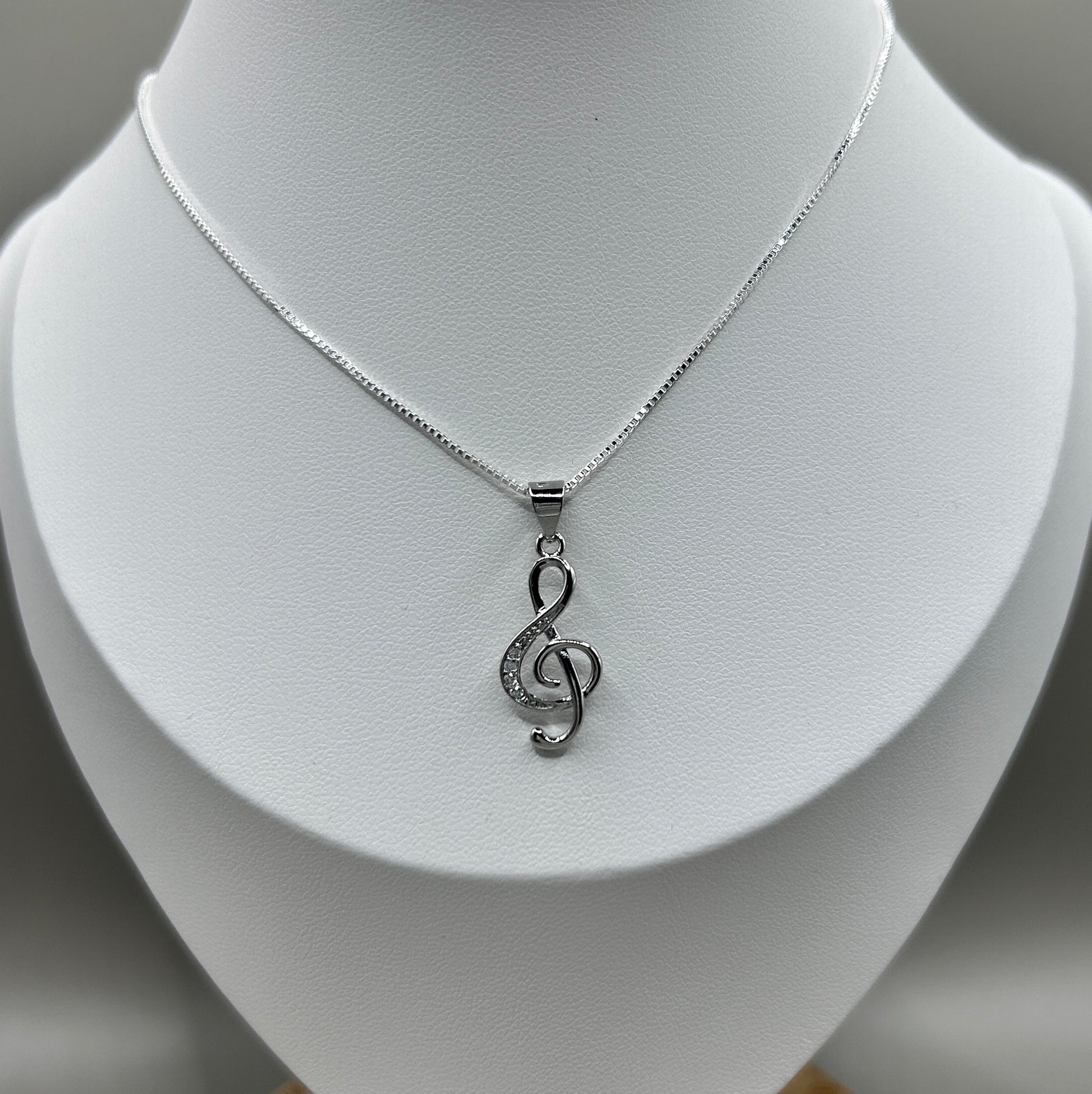 musical note pendant on silver box chain