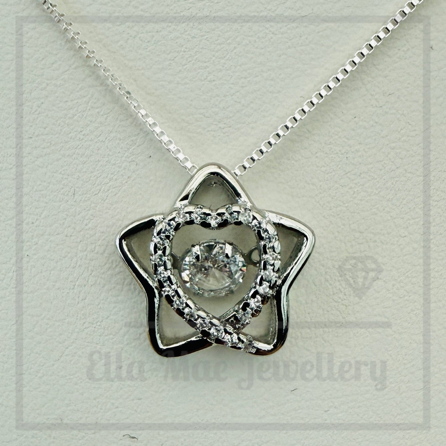 Star shaped pendant with crystal inner heart and dancing inner crystal