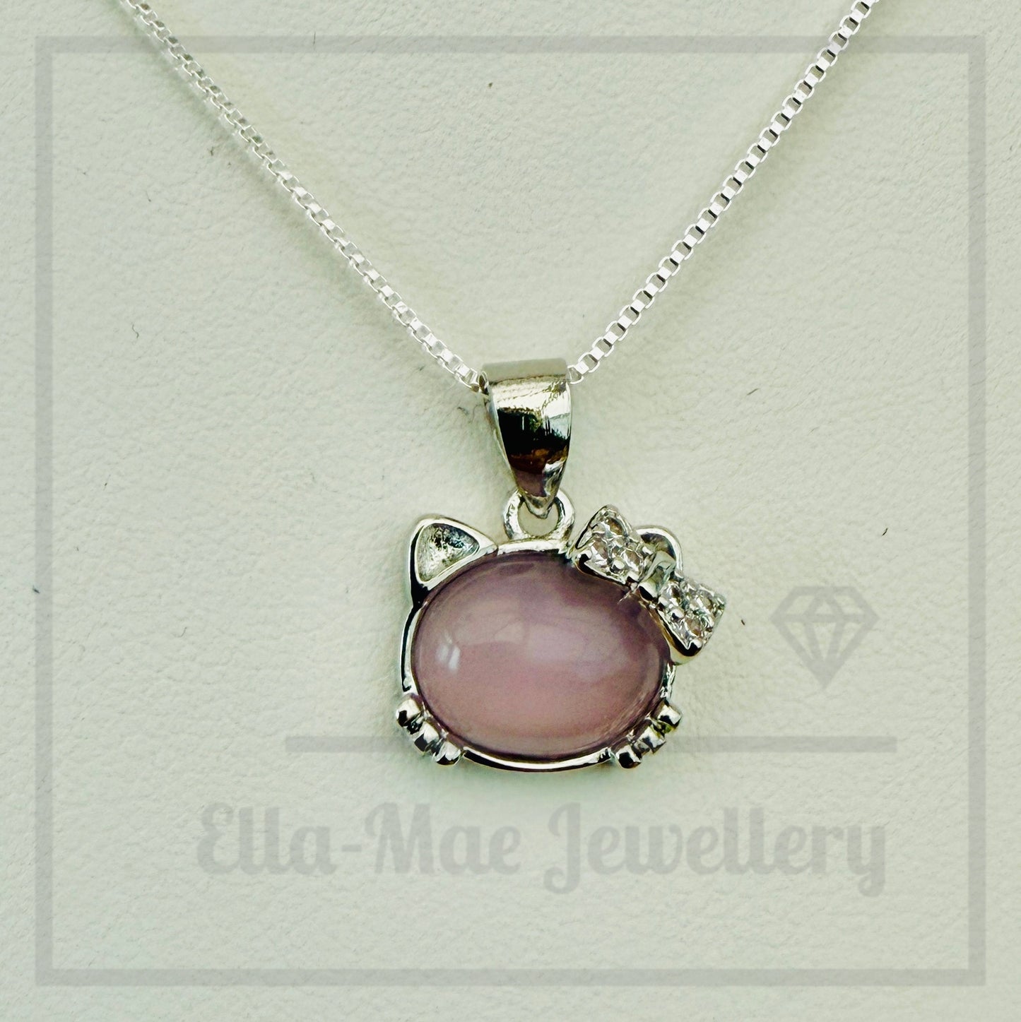 Necklace with a pink cat-shaped pendant on a white background, branded 'Ella-Mae Jewellery'.