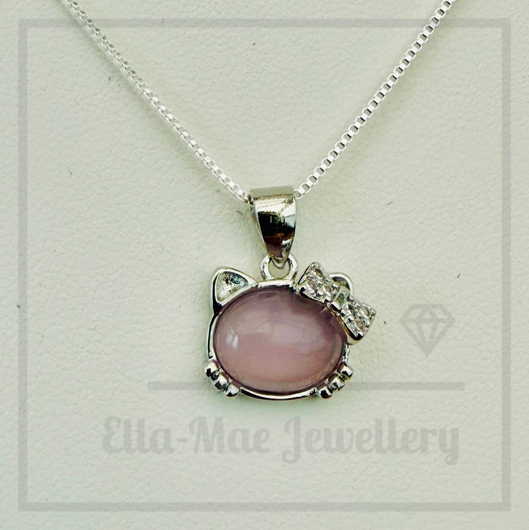 Necklace with a pink cat-shaped pendant on a white background, branded 'Ella-Mae Jewellery'.