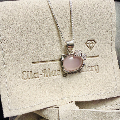 Cute Kitty pendant with pink opal on a silver chain, displayed on Ella Mae Jewellery branded gift pouch