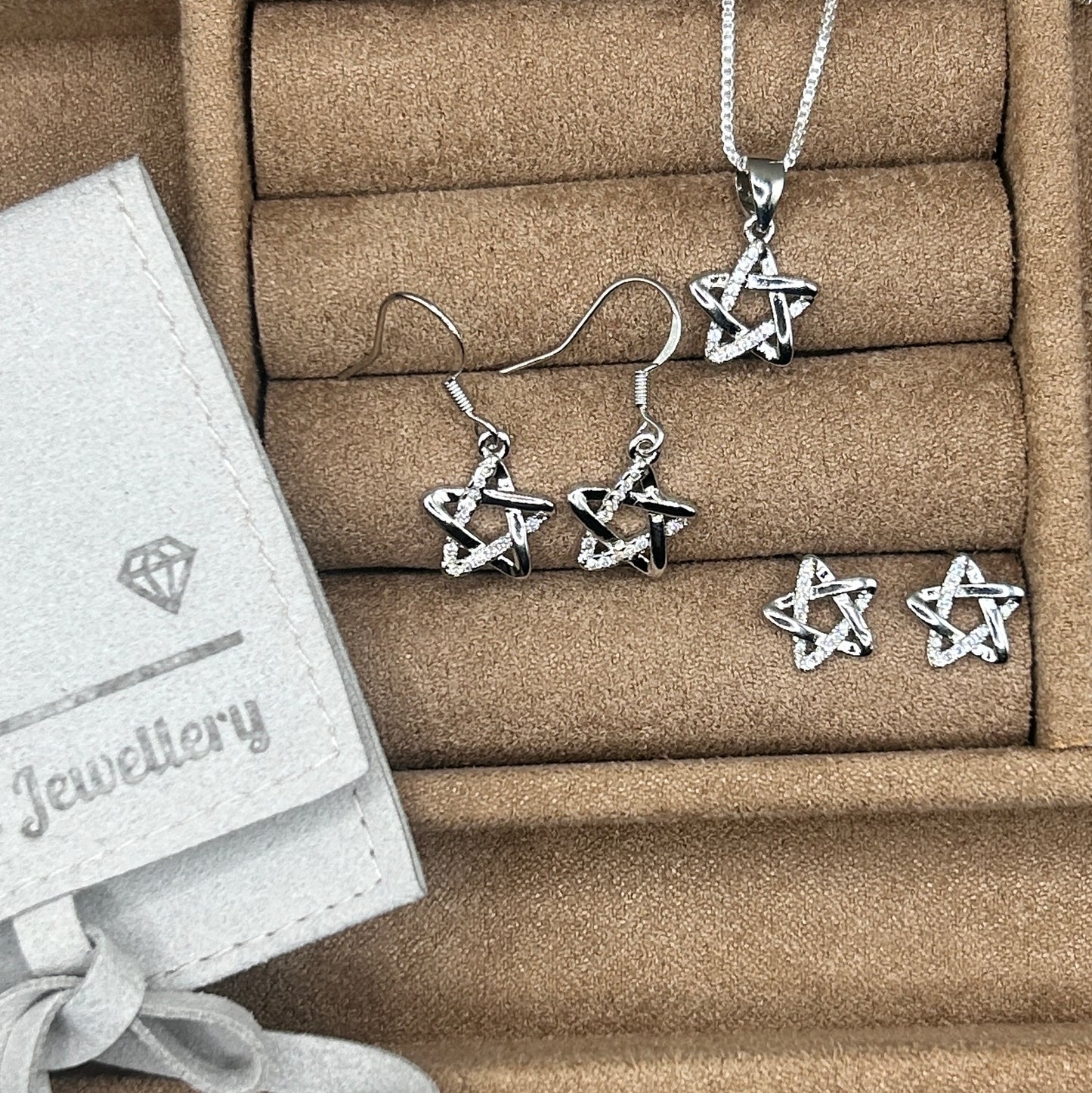 celestial star pendant with studs and drop earrings