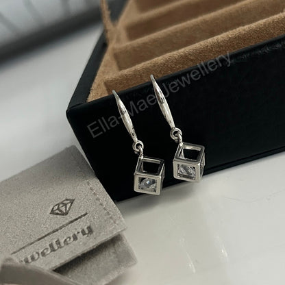 cubic zirconia cube dangling earrings on tray